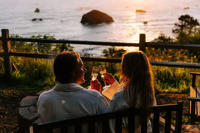 A couple relaxing with wine after their massage